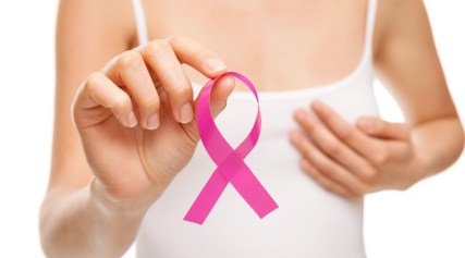 Woman with breast cancer awareness ribbon
